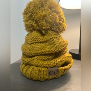 C.C mustard hat with big pom pom